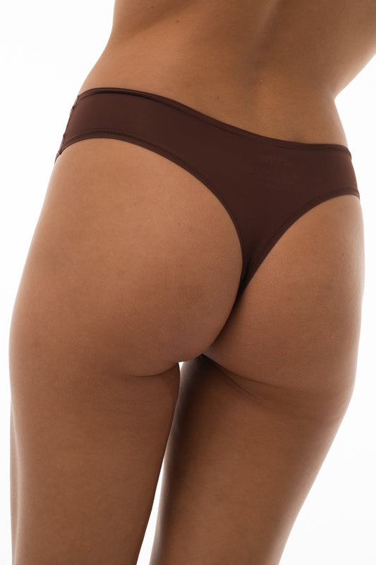 Brown high-waisted seamless thong, back view close-up — CARE